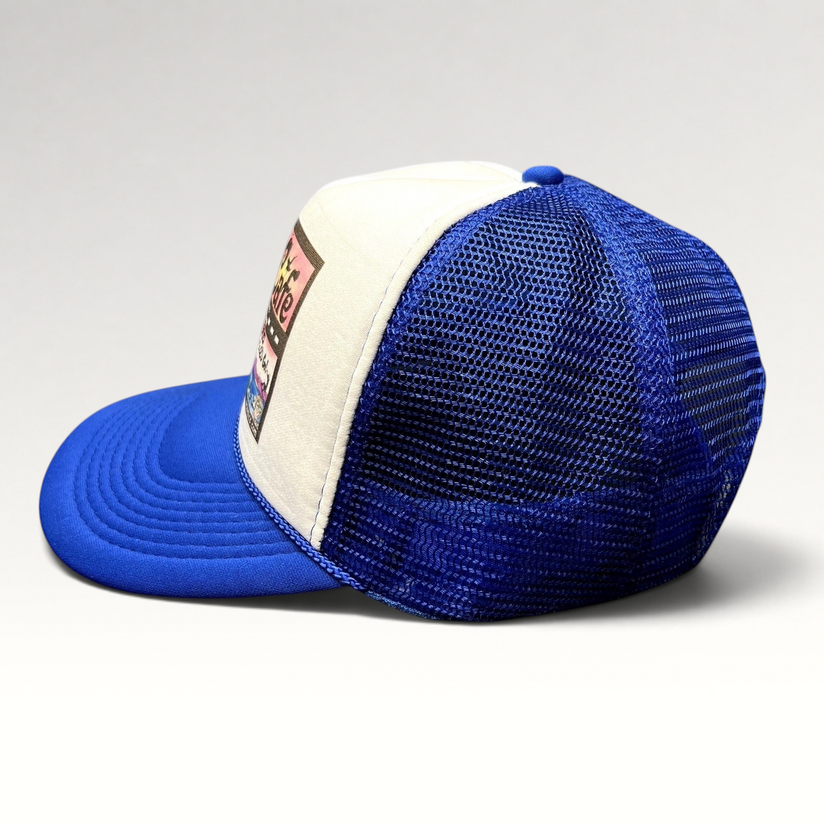 Raree Finds Mesa Cafe Santa Barbara trucker snapback hat in blue and white with foam front and mesh back side view