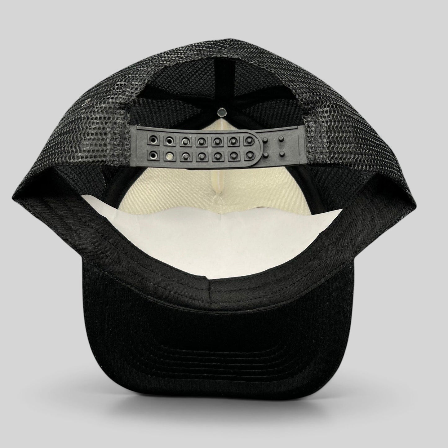 Raree Finds Metallica Mexican Militia Chapter trucker hat, back view showing black mesh and adjustable snapback closure.