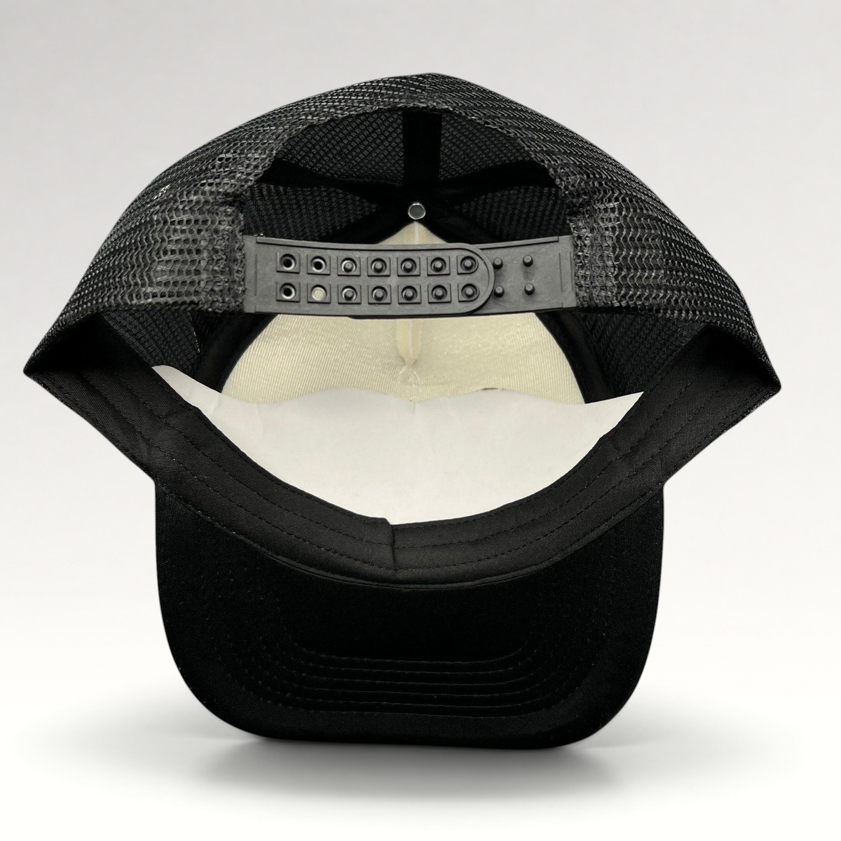 Raree Finds Metallica Mexican Militia Chapter trucker hat, back view showing black mesh and adjustable snapback closure.