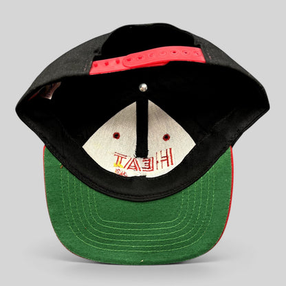 Raree Finds vintage Miami Heat snapback hat showing the interior green undervisor and red adjustable snap closure.