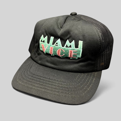 Raree Finds vintage Miami Vice black foam and mesh trucker hat with teal and pink embroidered logo and snapback.