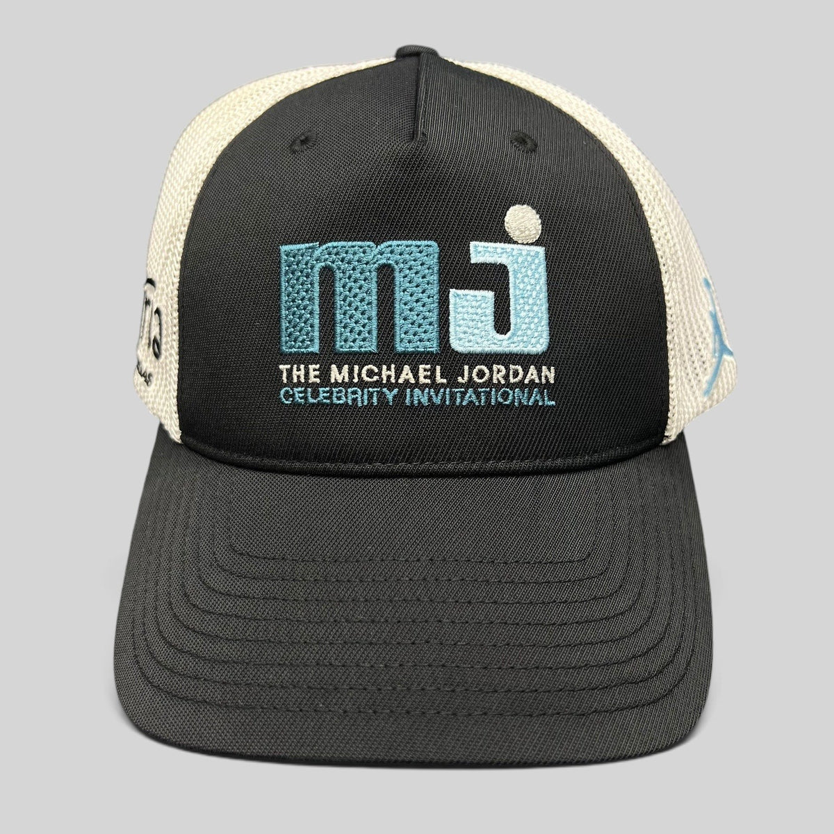 Raree Finds black and white Michael Jordan Celebrity Invitational mesh back Flexfit golf hat with embroidered logo