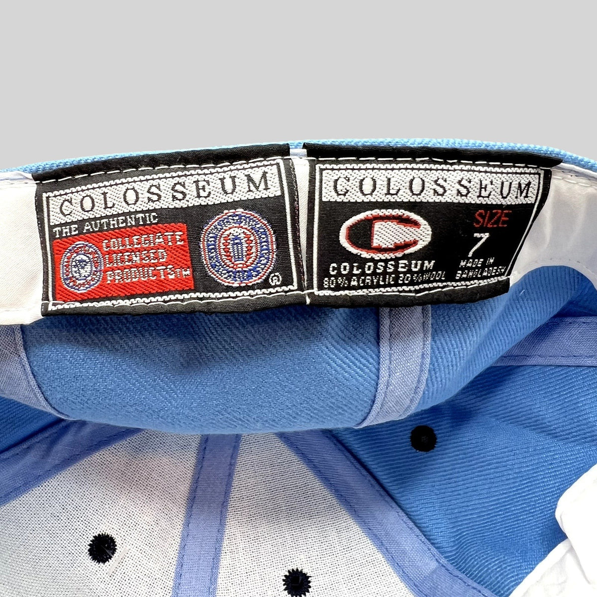 Raree Finds vintage Colosseum Michigan Wolverines fitted hat interior labels showing size 7 and material composition