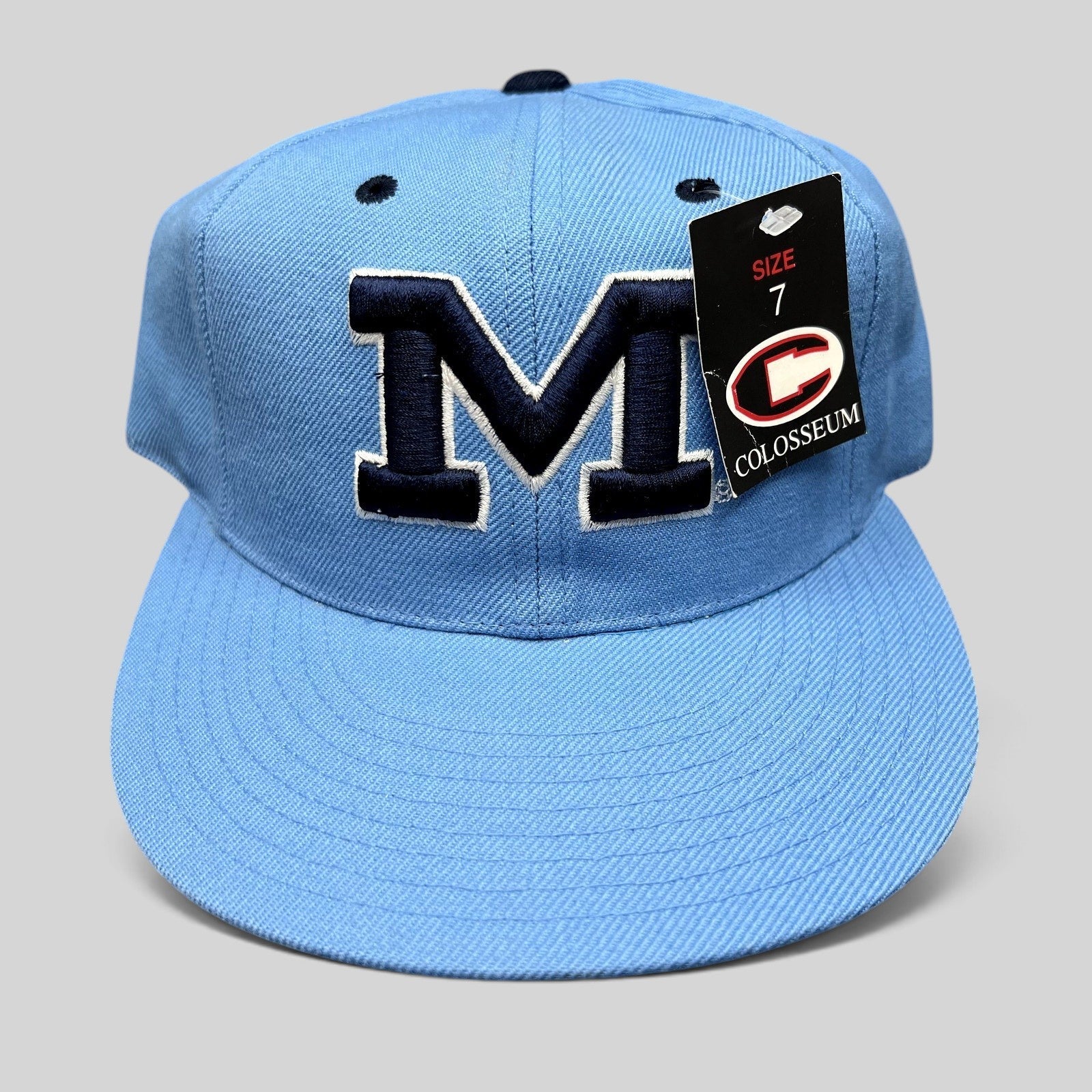 Raree Finds vintage Michigan Wolverines fitted hat in light blue with navy embroidered M logo and size 7 tag