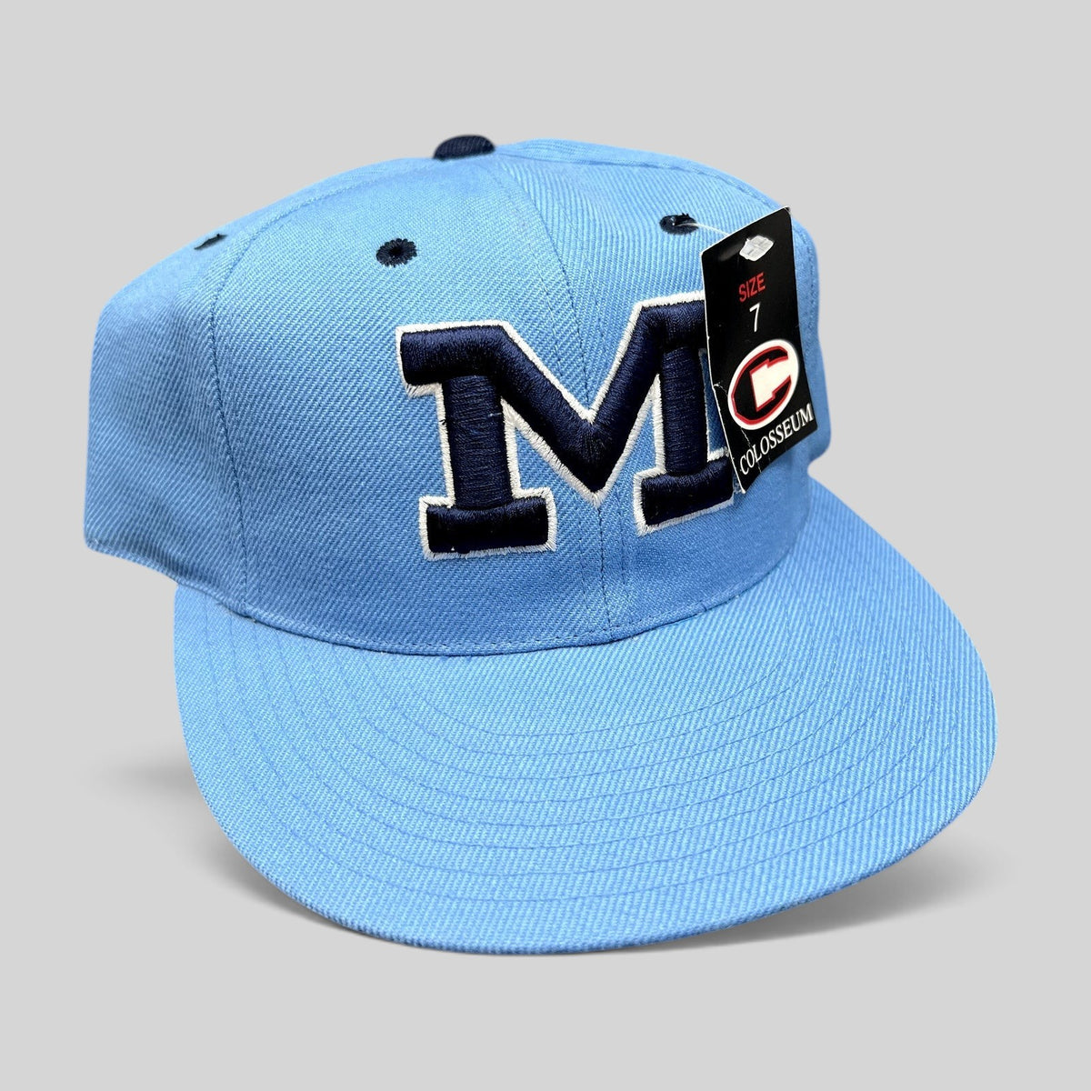 Raree Finds vintage Michigan Wolverines fitted hat in light blue with navy raised embroidered M logo and size tag.