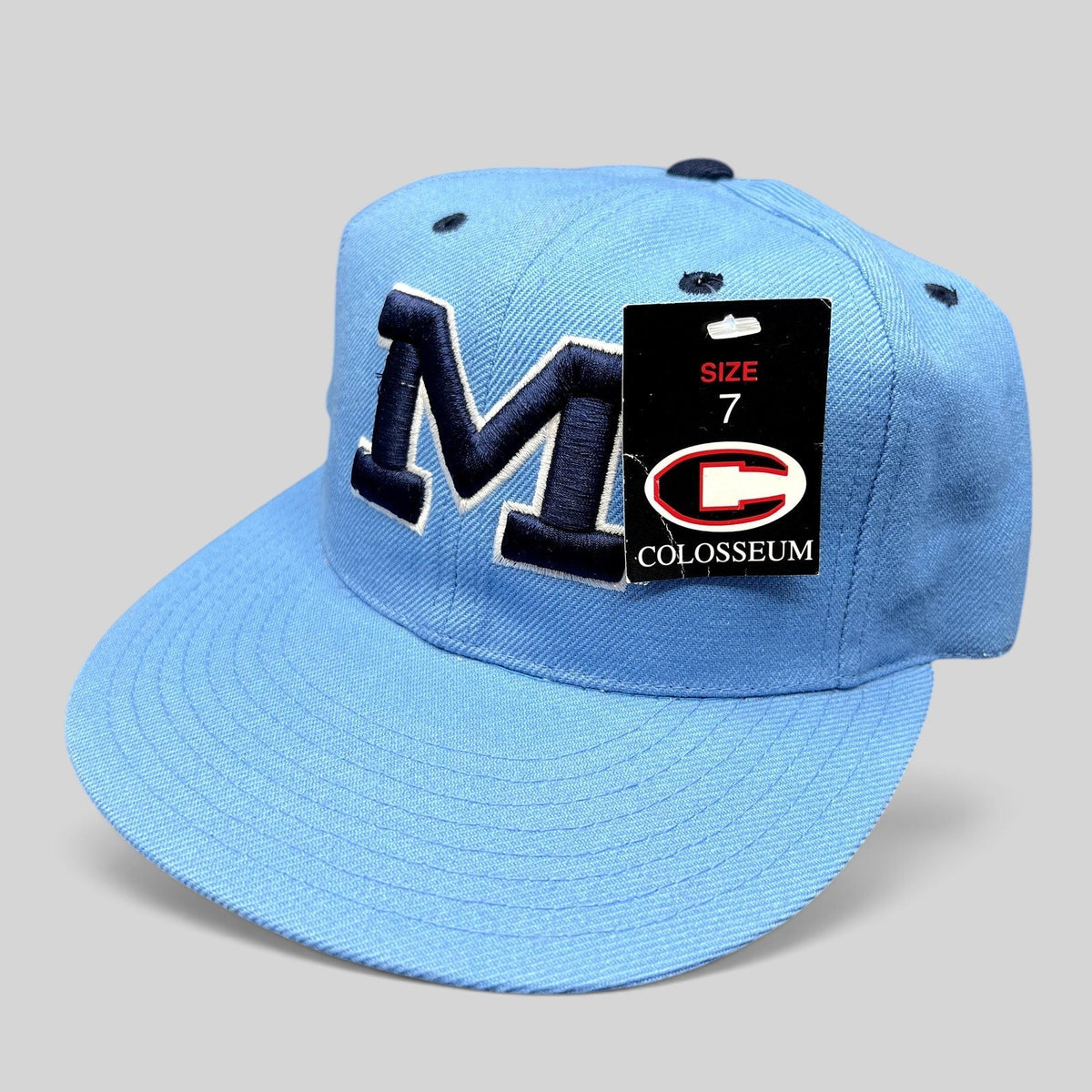 Raree Finds vintage light blue Michigan Wolverines fitted hat with navy raised embroidered M logo and size 7 tag