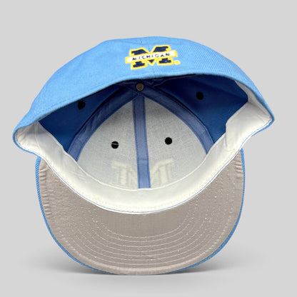 Raree Finds vintage Michigan Wolverines fitted hat in light blue with navy embroidery and a gray undervisor