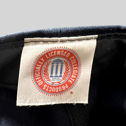 Raree Finds vintage Michigan Wolverines hat interior tag showing the Officially Licensed Collegiate Products logo