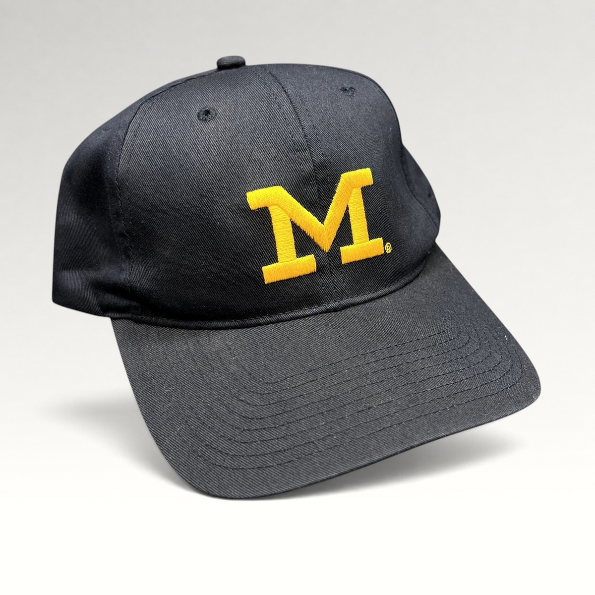 Raree Finds vintage Michigan Wolverines navy blue snapback hat with maize embroidered Block M logo and gray undervisor