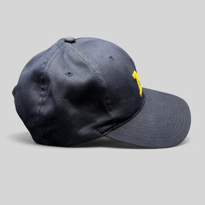 Raree Finds vintage navy blue Michigan Wolverines snapback hat with maize Block M embroidery and gray undervisor.