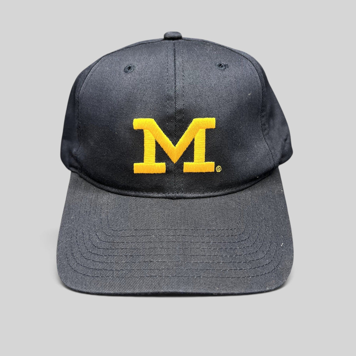 Raree Finds vintage Michigan Wolverines navy blue snapback hat with embroidered maize Block M logo and gray undervisor