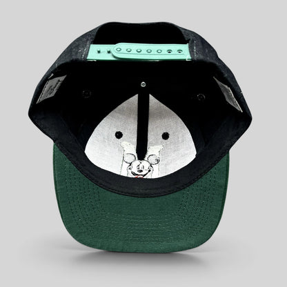Raree Finds vintage 90s Disney Store Mickey Mouse snapback hat showing the green adjustable closure and green brim