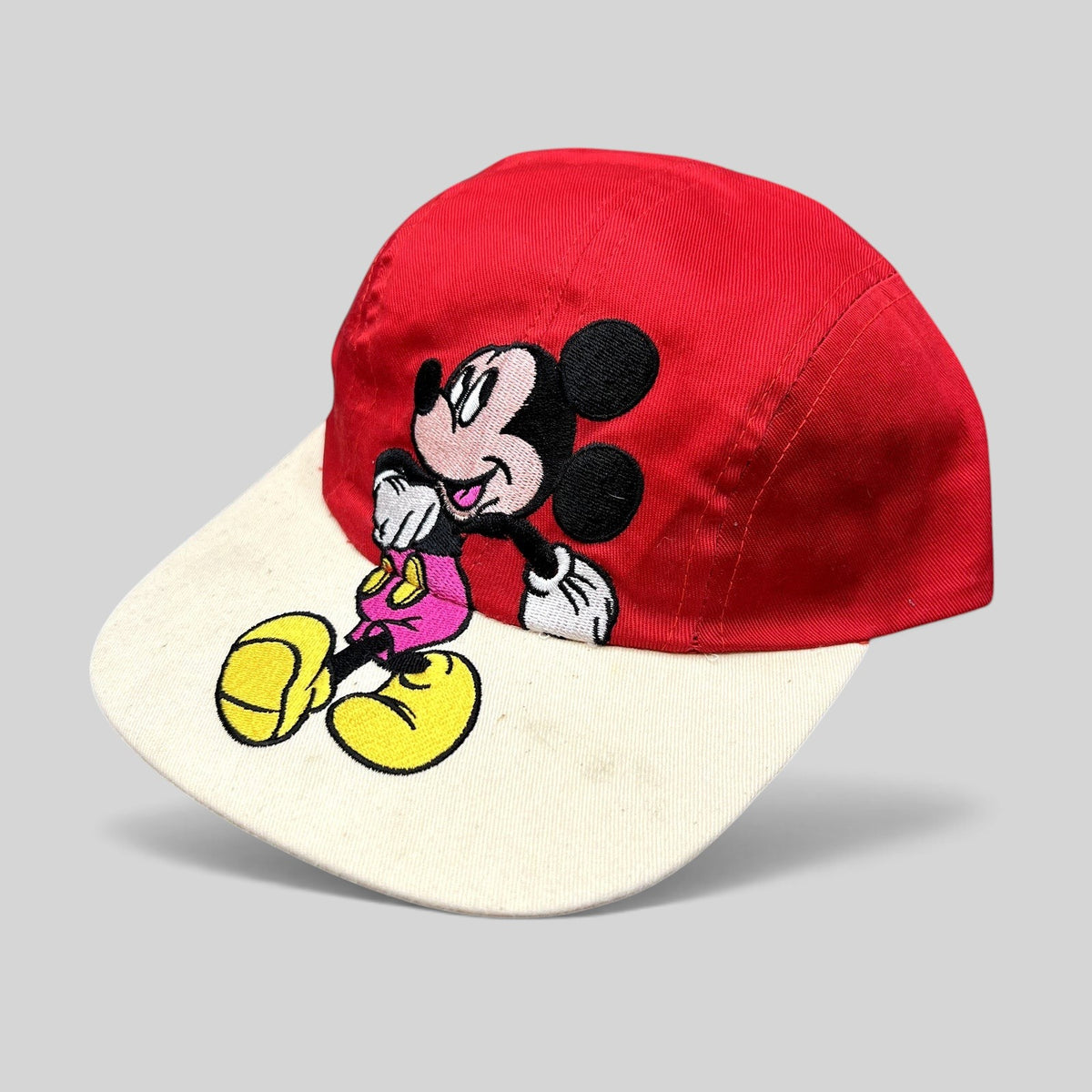 Raree Finds Disney Mickey Mouse youth snapback hat with red crown, white brim, and large embroidered Mickey graphic.