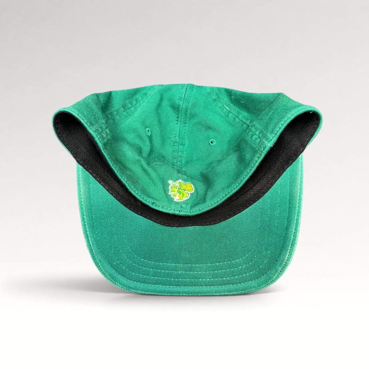 Raree Finds vintage 90s Mickey’s Malt Liquor green cotton cap featuring a gold hornet logo on the back