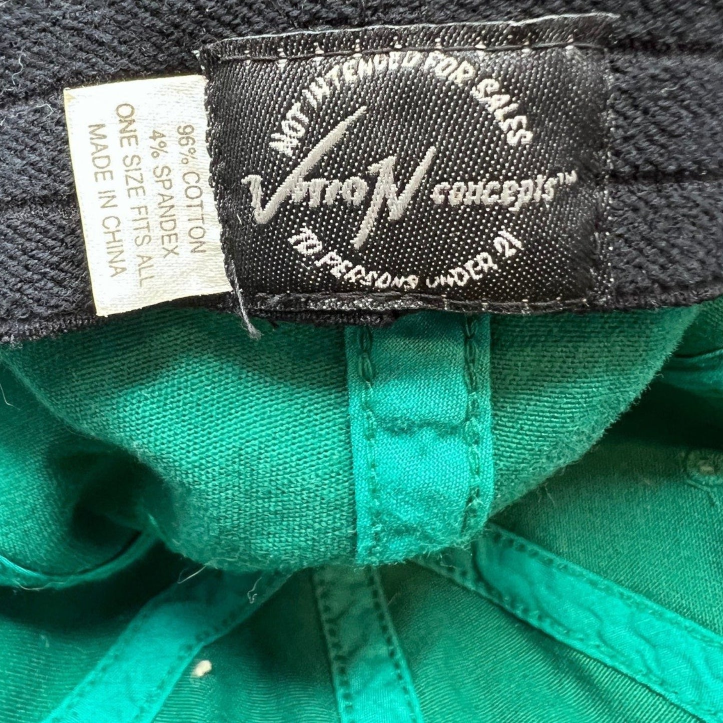 Raree Finds vintage 90s Mickey’s Malt Liquor hat interior label showing Vision Concepts branding and material details