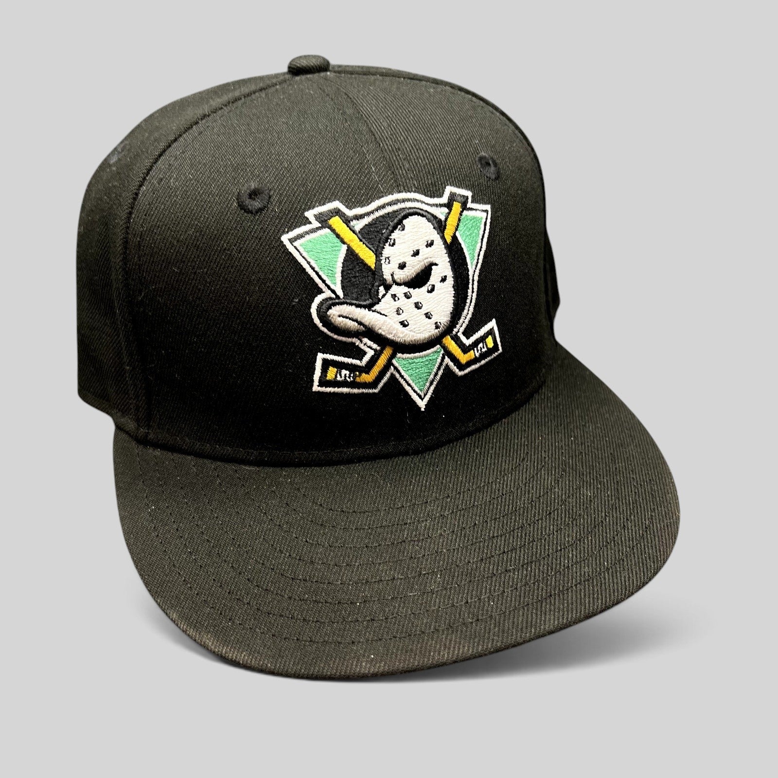 Raree Finds black New Era 59FIFTY Mighty Ducks 30th Anniversary fitted hat with embroidered goalie mask logo