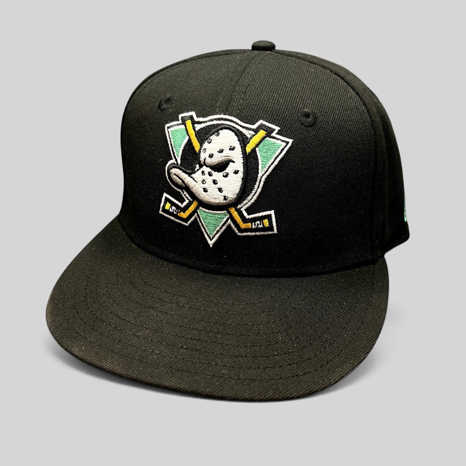 Raree Finds black New Era 59FIFTY fitted hat featuring the embroidered Anaheim Mighty Ducks goalie mask logo.