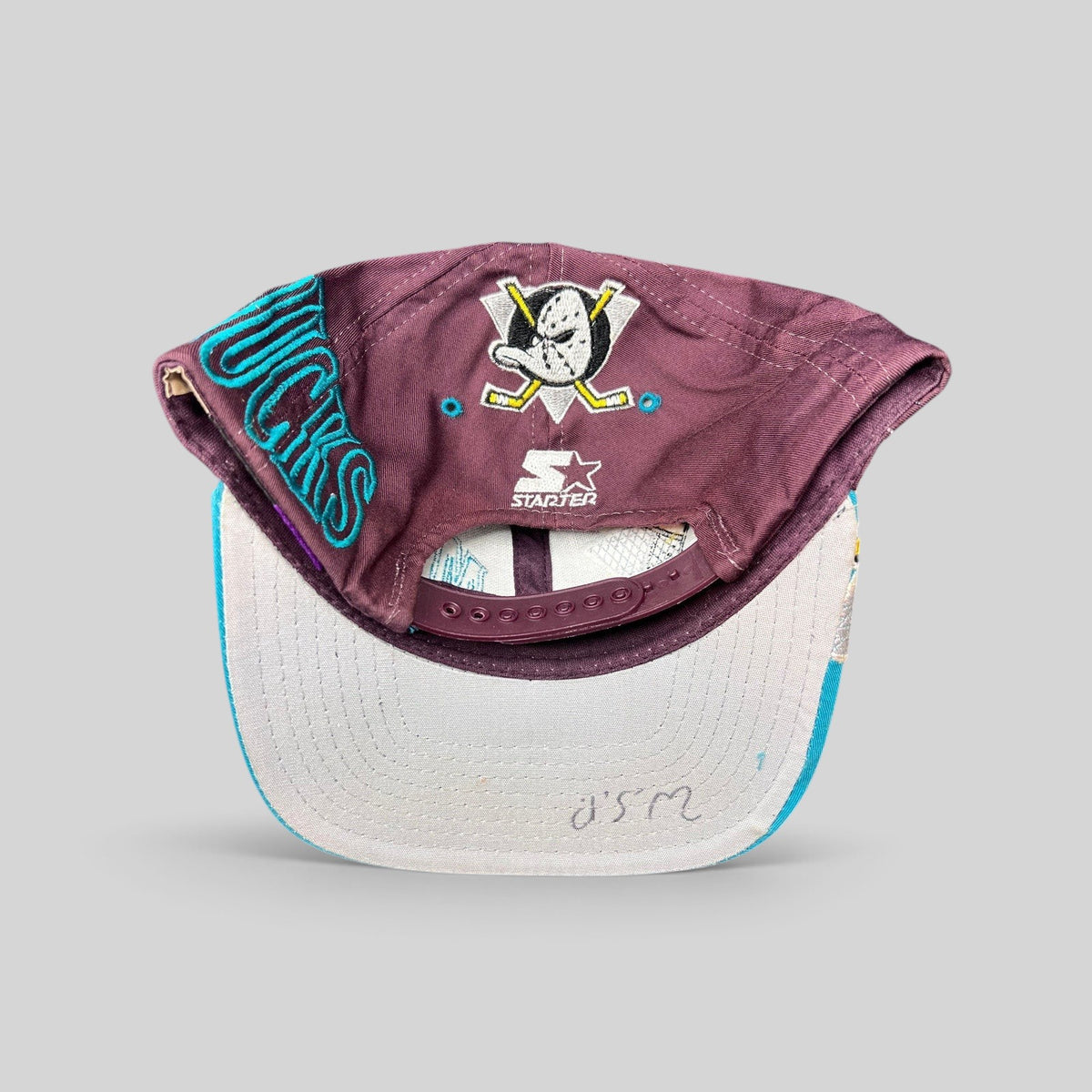 Raree Finds vintage 90s Anaheim Mighty Ducks Starter snapback hat showing the embroidered logo on the back and brim