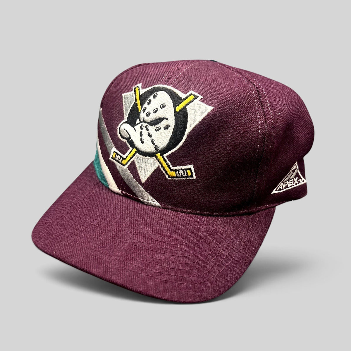 Raree Finds vintage Anaheim Mighty Ducks Apex One snapback hat in maroon with teal and silver wave logo embroidery