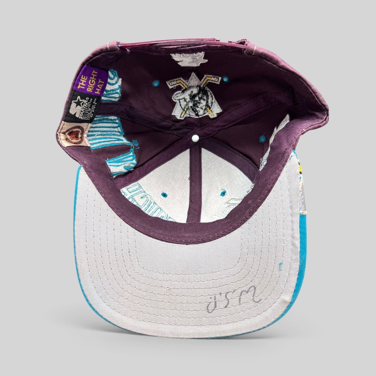 Raree Finds vintage 90s Anaheim Mighty Ducks Starter snapback hat interior view showing gray undervisor and branding