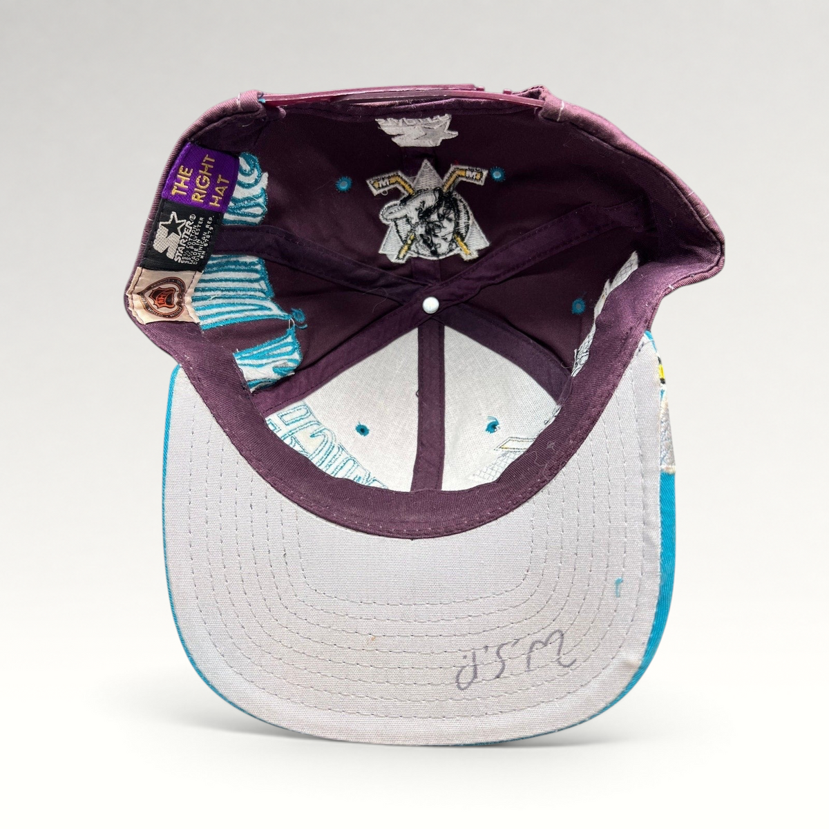 Raree Finds vintage 90s Anaheim Mighty Ducks Starter snapback hat interior view showing gray undervisor and branding