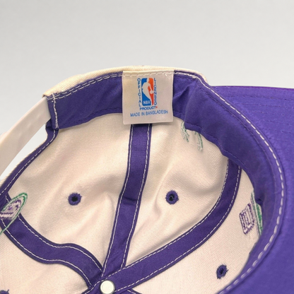Raree Finds vintage Milwaukee Bucks snapback interior showing official NBA licensed product tag and purple lining
