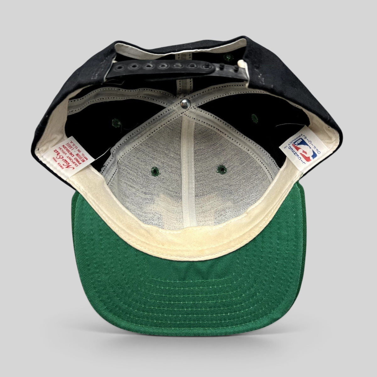 Raree Finds vintage Milwaukee Bucks New Era snapback hat interior showing green undervisor and USA made tags
