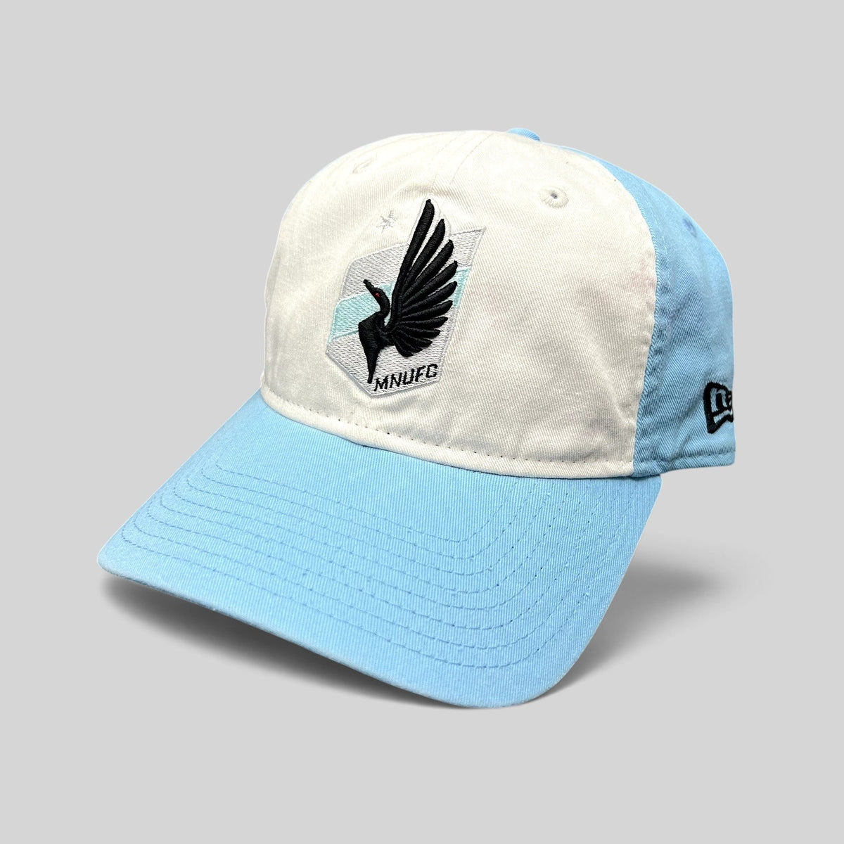 Raree Finds Minnesota United FC New Era 9TWENTY hat with white front panel, light blue crown, and black loon crest.