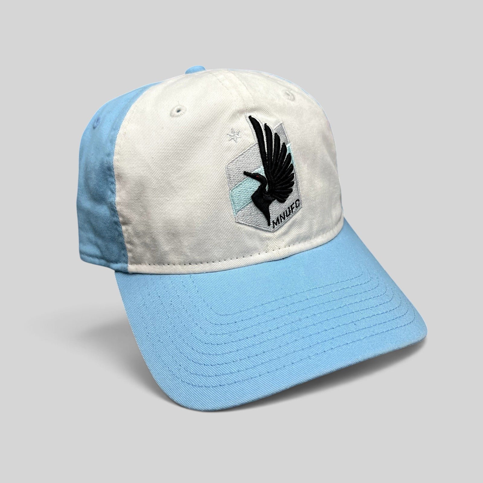 Raree Finds Minnesota United FC New Era 9TWENTY strapback hat with white front panel, light blue crown, and loon crest
