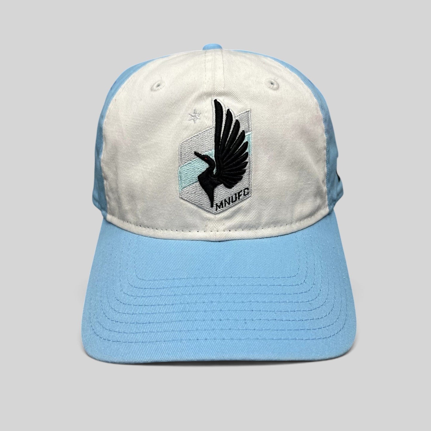 Raree Finds Minnesota United FC New Era 9TWENTY hat with white front panel, light blue crown, and black loon crest.