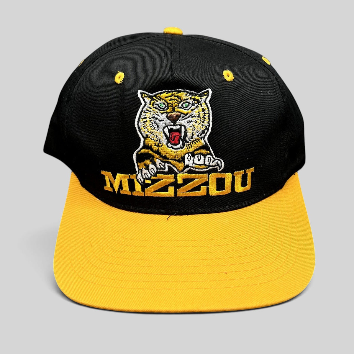 Raree Finds vintage University of Missouri Mizzou snapback hat in black and gold with embroidered tiger mascot logo