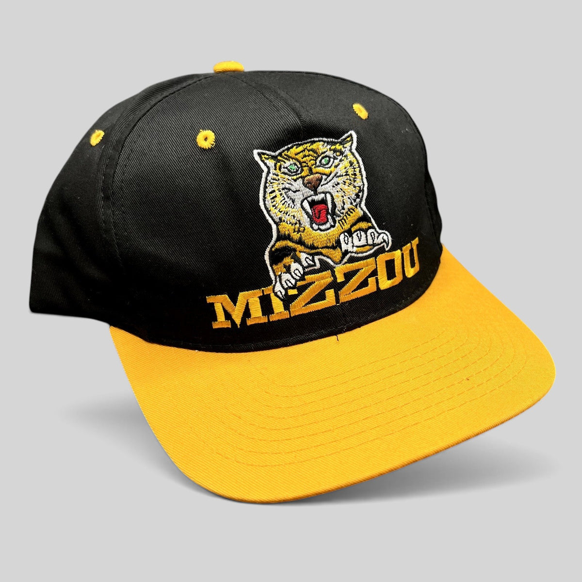 Raree Finds vintage University of Missouri Mizzou Tigers snapback hat in black and gold with embroidered tiger mascot.