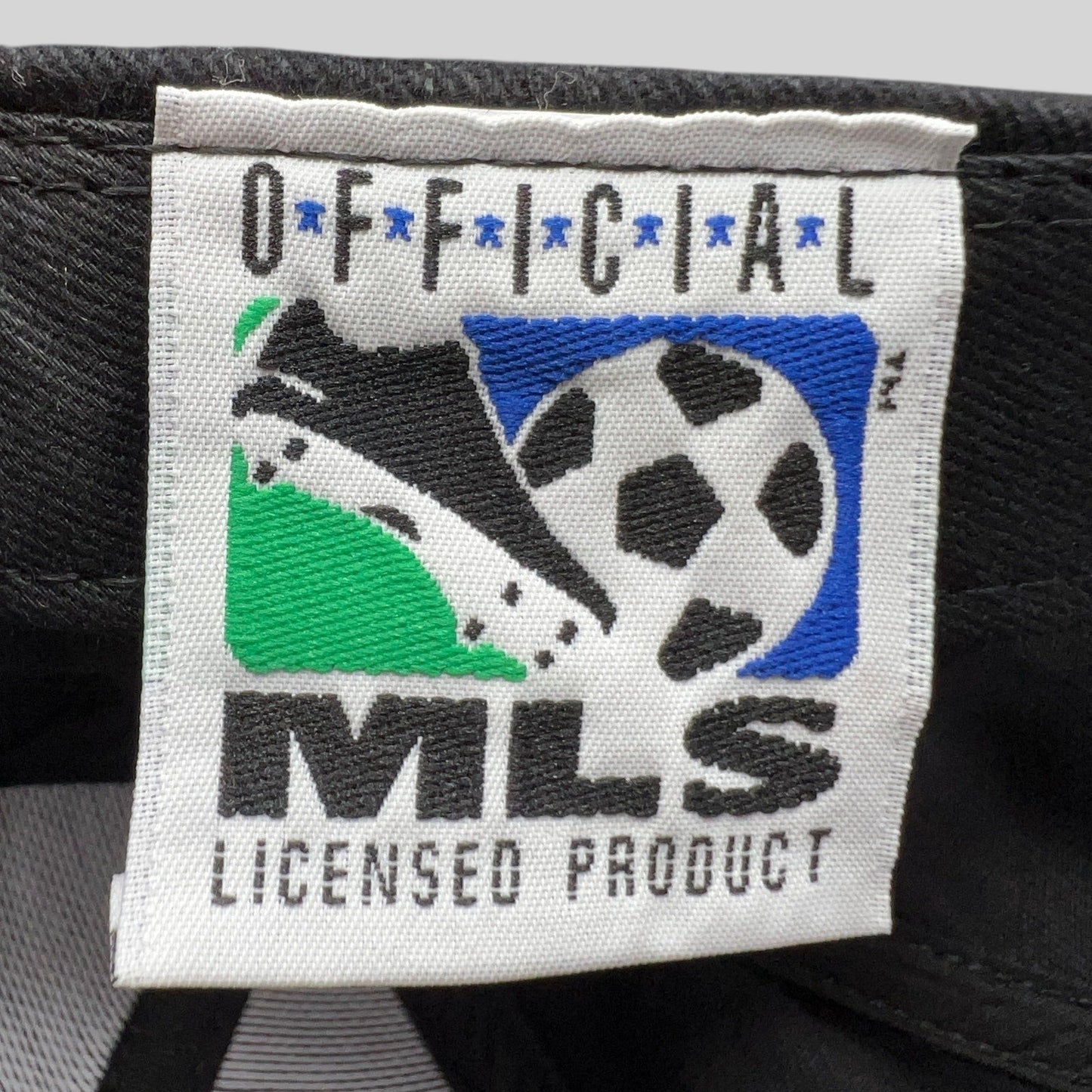 Raree Finds vintage 1998 MLS Cup hat interior tag showing Official MLS Licensed Product branding on black fabric