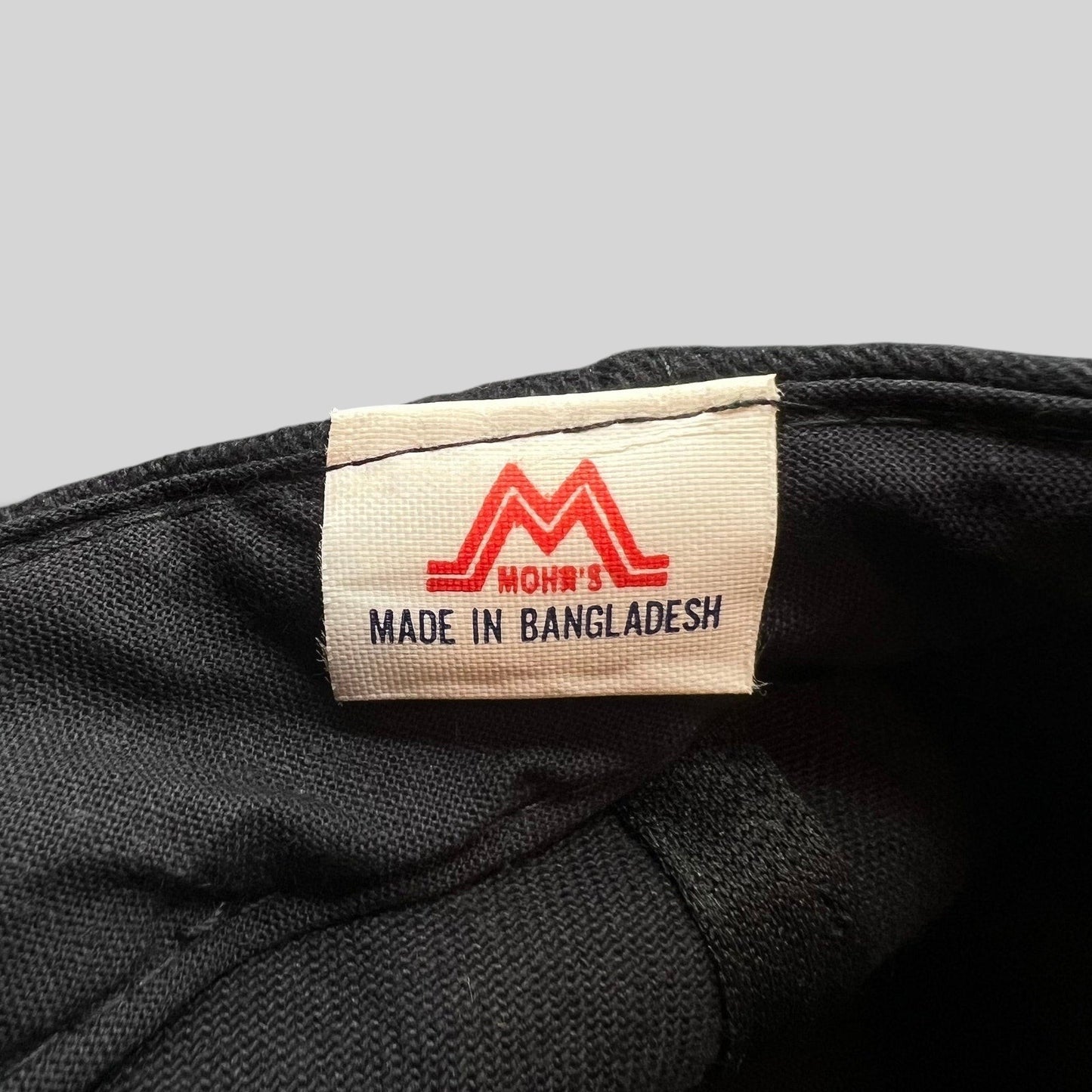 Raree Finds Mohrs brand tag inside a black cotton snapback hat with red logo detail