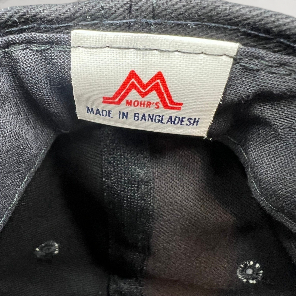 Raree Finds vintage 90s Mohr's hat interior label showing brand logo and Made in Bangladesh text on black cotton