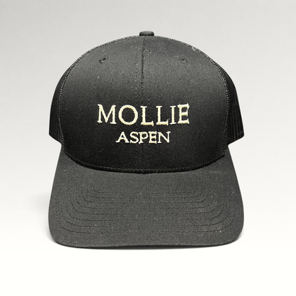 Raree Finds black MOLLIE Aspen Yupoong Classics trucker hat with embroidered logo and breathable mesh back panels