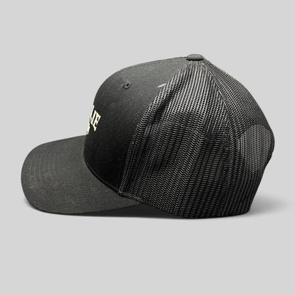 Raree Finds MOLLIE Aspen black trucker hat with breathable mesh back and structured front panel side view