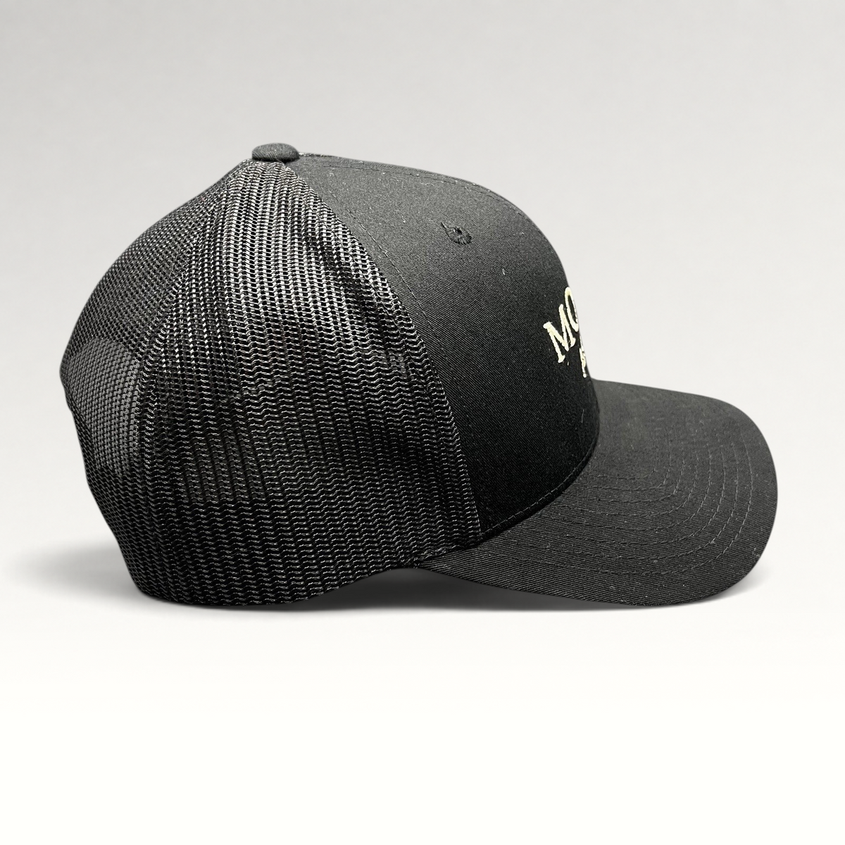 Raree Finds MOLLIE Aspen black trucker hat with breathable mesh back and structured front embroidery