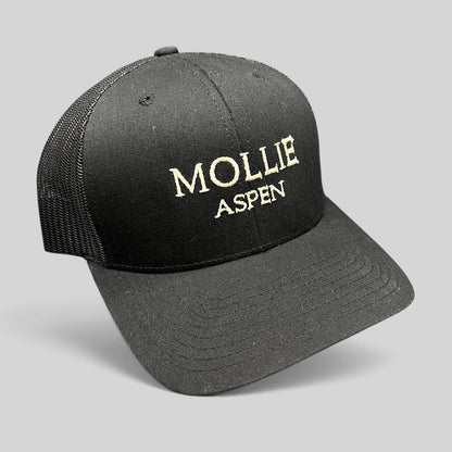 Raree Finds black MOLLIE Aspen trucker hat with embroidered logo and breathable mesh back panels