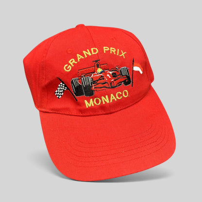 Raree Finds vintage red Monaco Grand Prix strapback hat with embroidered Formula 1 race car and checkered flags.