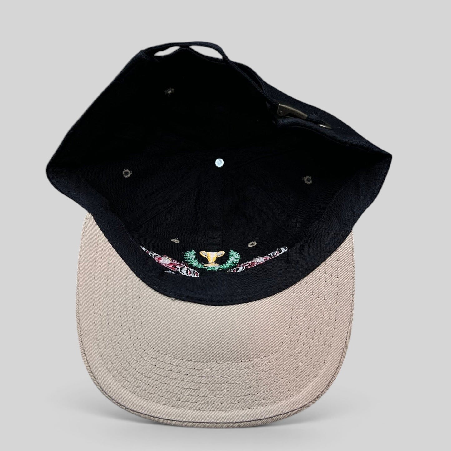 Raree Finds vintage Monaco Grand Prix racing hat with black crown, beige brim, and embroidered race car trophy design.
