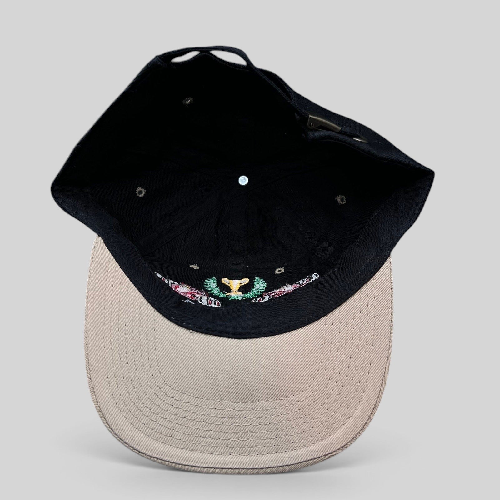 Raree Finds vintage Monaco Grand Prix racing hat with black crown, beige brim, and embroidered race car trophy design.