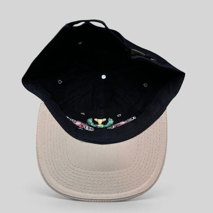Raree Finds vintage Monaco Grand Prix racing hat with black crown, beige brim, and embroidered race car trophy design.