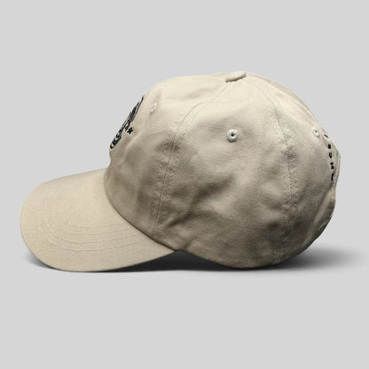 Raree Finds Monopoly GO cream strapback hat with curved brim and embroidered front logo in a side profile view