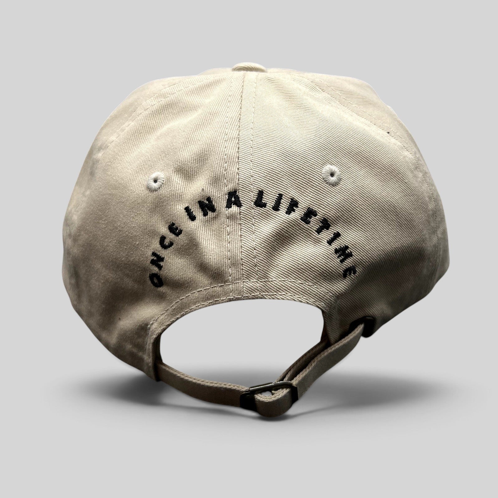Raree Finds Monopoly GO cream strapback hat with Once In A Lifetime embroidered on the back and adjustable buckle