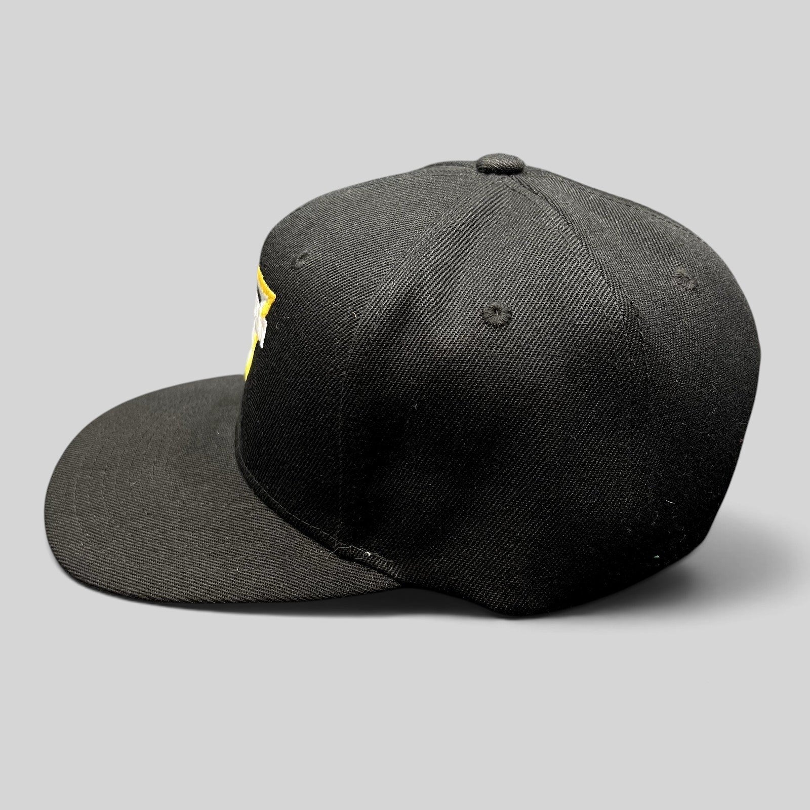 Raree Finds black Monster Jam snapback hat with flat bill and yellow and white embroidered logo on the side profile