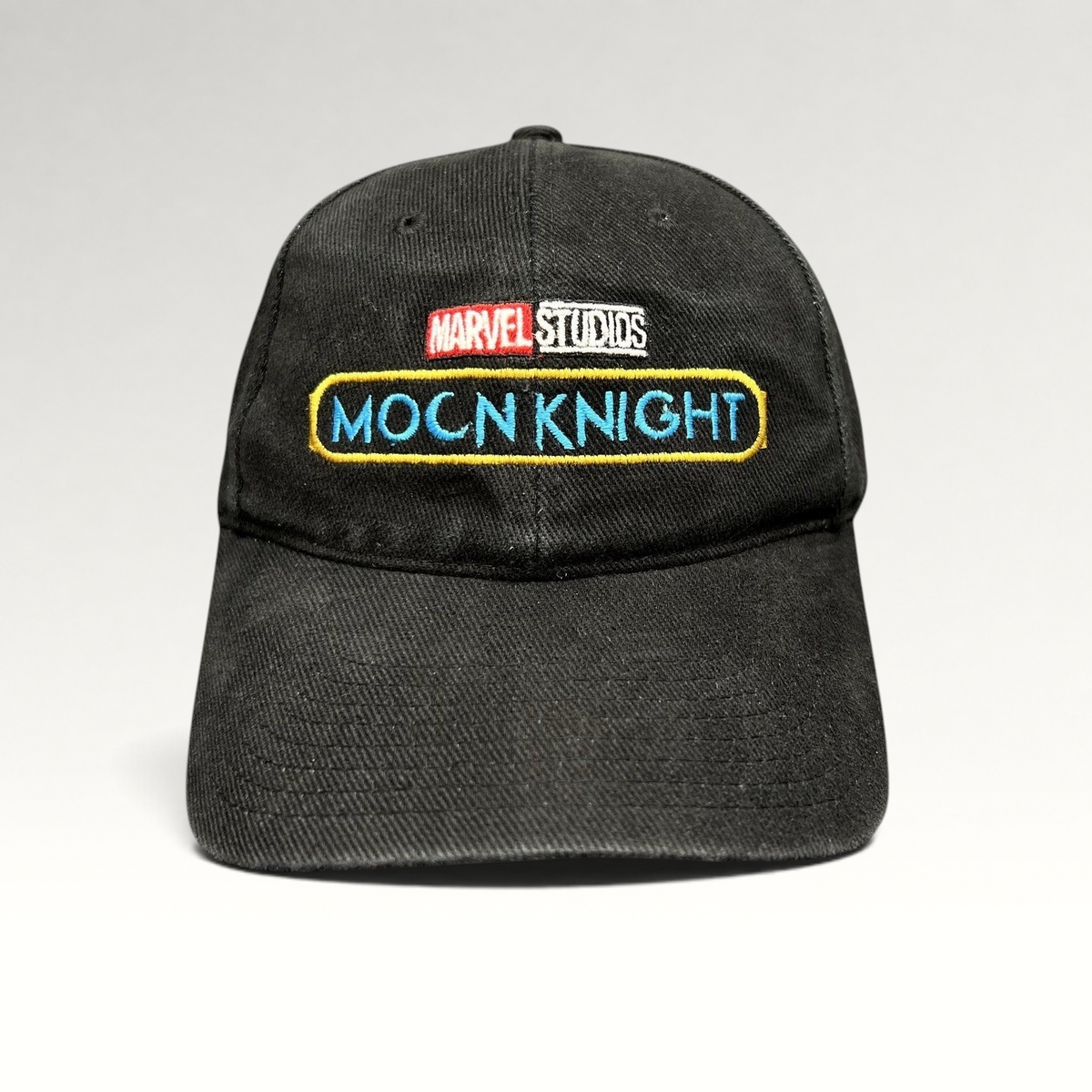 Raree Finds black cotton strapback hat with embroidered Marvel Studios and Moon Knight logos from the Disney+ series.