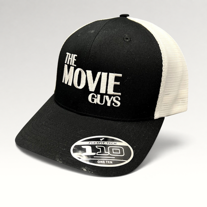Raree Finds The Movie Guys black and white trucker hat with embroidered logo, mesh back, and Flexfit 110 sticker.