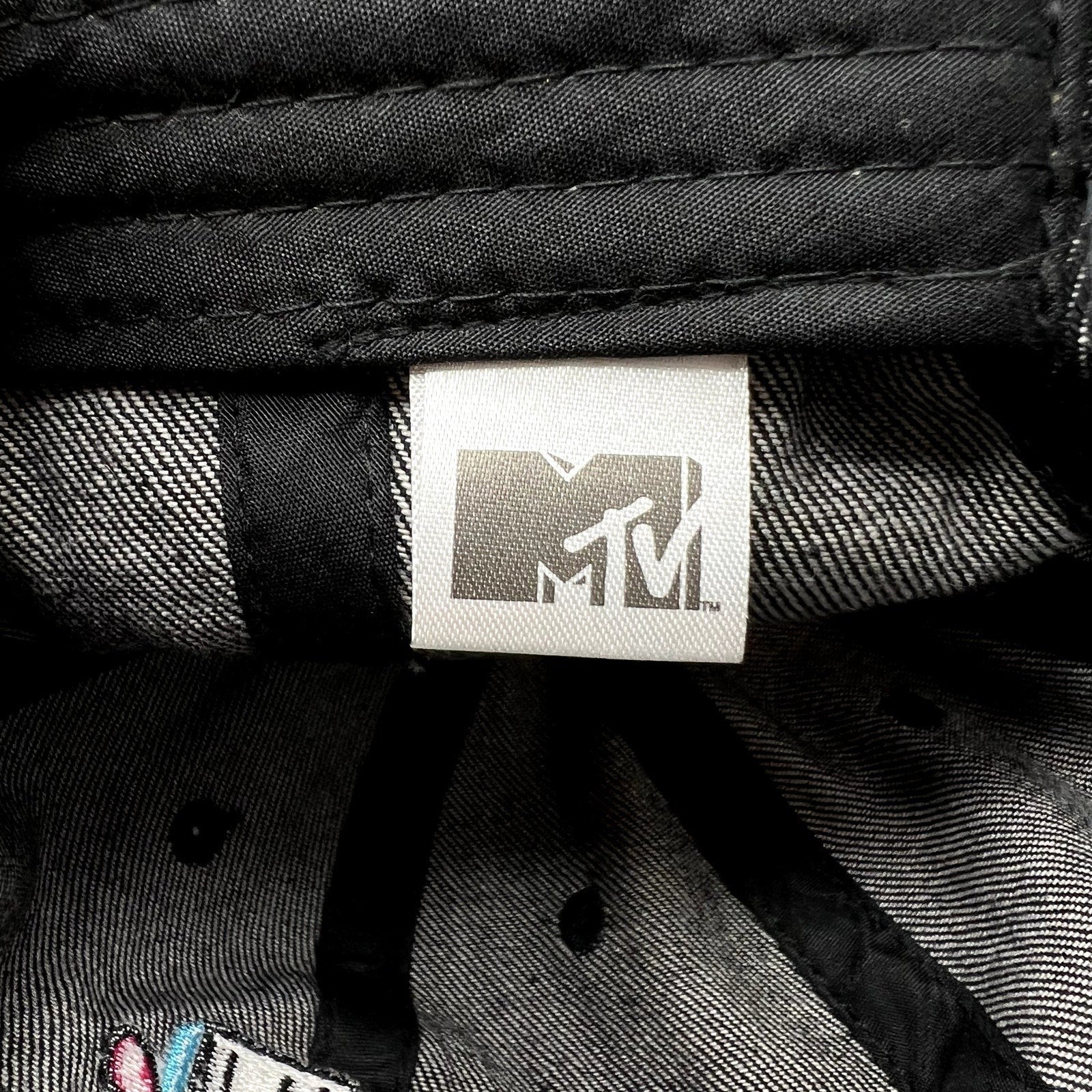 Raree Finds black MTV Music Television cap interior showing the official branded fabric tag and stitching