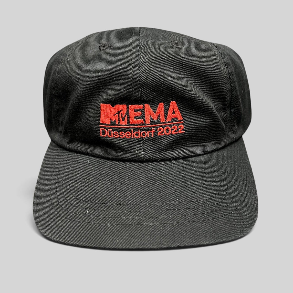 Raree Finds black Beechfield strapback hat with red embroidered MTV EMA Düsseldorf 2022 logo on the front panel.